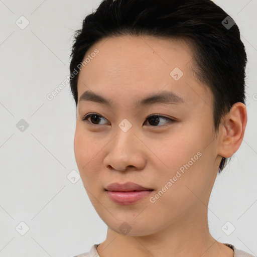 Joyful asian young-adult female with short  brown hair and brown eyes