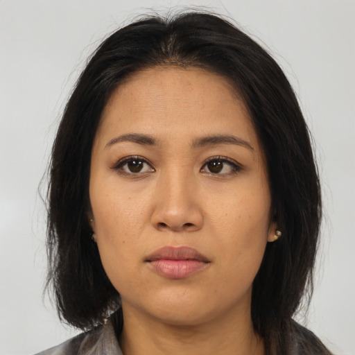 Neutral asian young-adult female with medium  brown hair and brown eyes