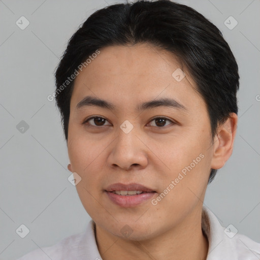 Joyful asian young-adult female with short  brown hair and brown eyes