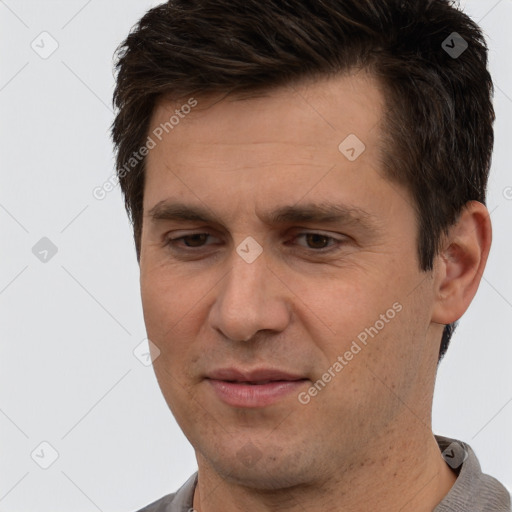 Joyful white adult male with short  brown hair and brown eyes