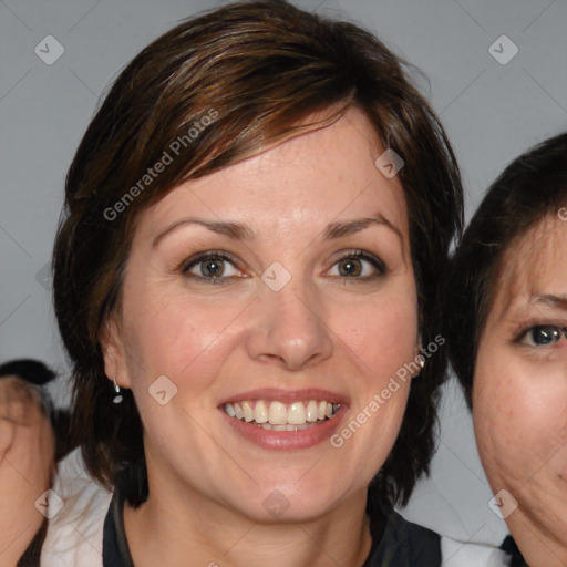 Joyful white adult female with medium  brown hair and blue eyes