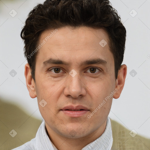 Joyful white adult male with short  brown hair and brown eyes