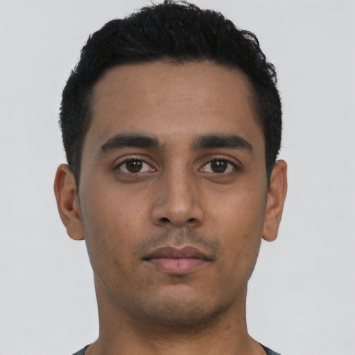 Neutral latino young-adult male with short  black hair and brown eyes