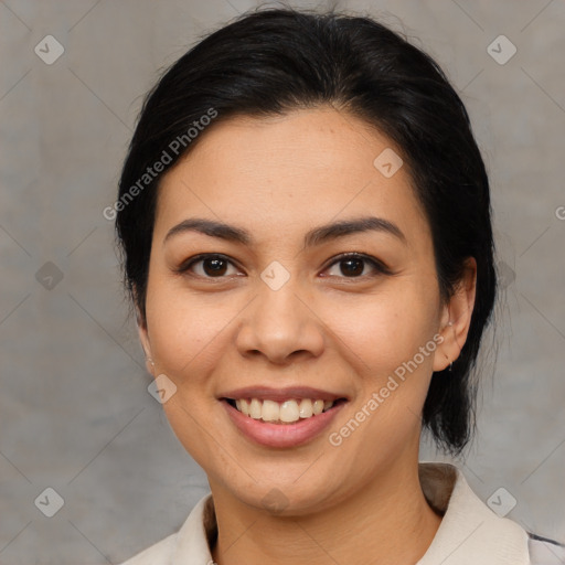 Joyful latino young-adult female with medium  brown hair and brown eyes