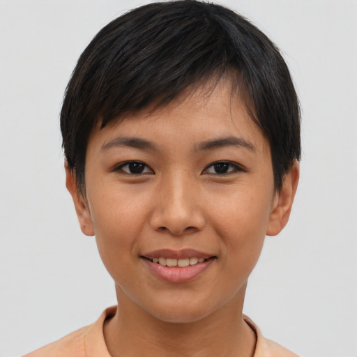 Joyful asian young-adult female with short  black hair and brown eyes