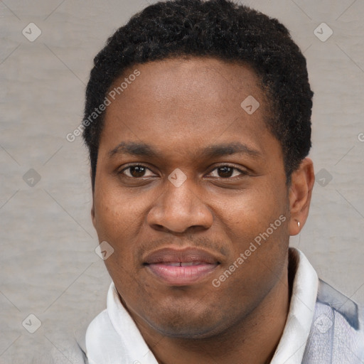 Joyful black young-adult male with short  brown hair and brown eyes