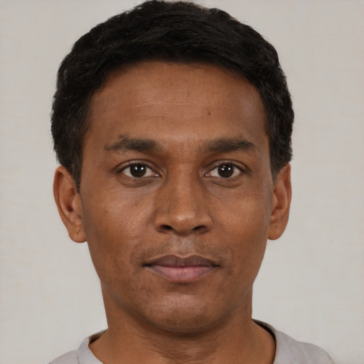 Neutral black young-adult male with short  black hair and brown eyes