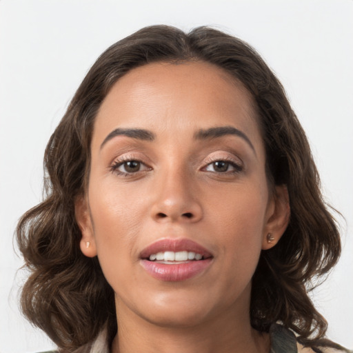 Joyful white young-adult female with long  brown hair and brown eyes