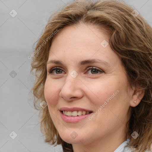 Joyful white young-adult female with medium  brown hair and blue eyes