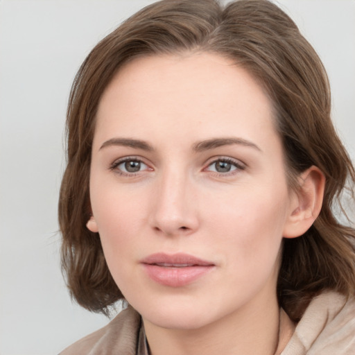 Neutral white young-adult female with medium  brown hair and grey eyes