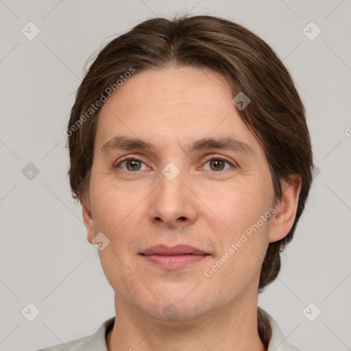 Joyful white adult male with short  brown hair and grey eyes