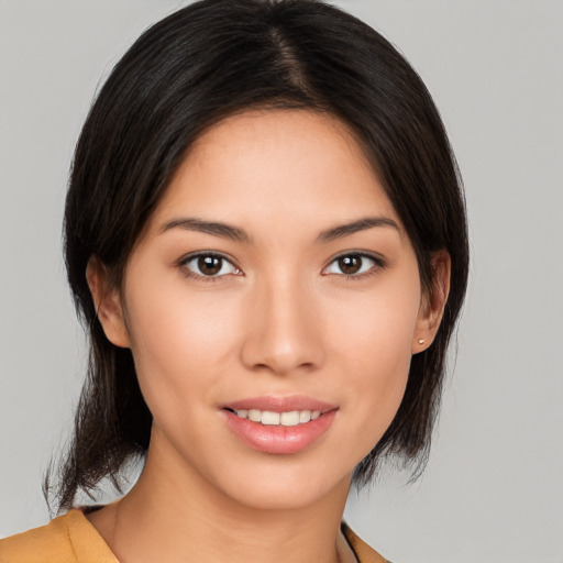 Joyful asian young-adult female with medium  brown hair and brown eyes