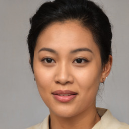 Joyful asian young-adult female with medium  brown hair and brown eyes