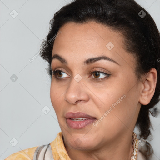 Joyful latino young-adult female with short  brown hair and brown eyes