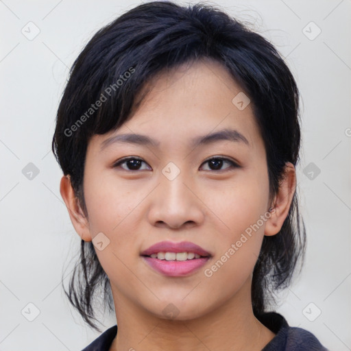 Joyful asian young-adult female with medium  black hair and brown eyes