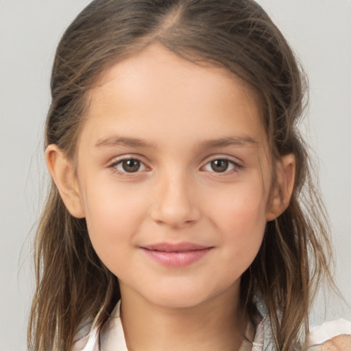 Joyful white child female with medium  brown hair and brown eyes