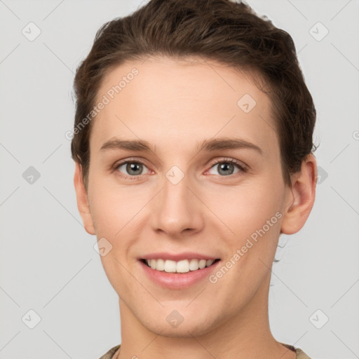 Joyful white young-adult female with short  brown hair and grey eyes