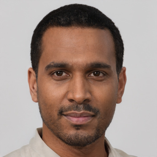 Neutral black young-adult male with short  black hair and brown eyes