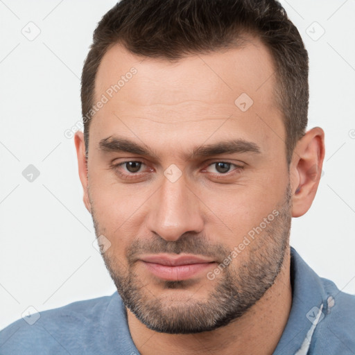 Joyful white young-adult male with short  brown hair and brown eyes