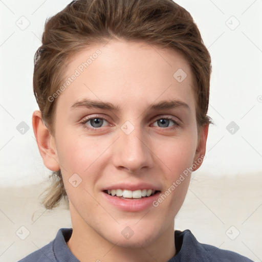 Joyful white young-adult female with short  brown hair and grey eyes