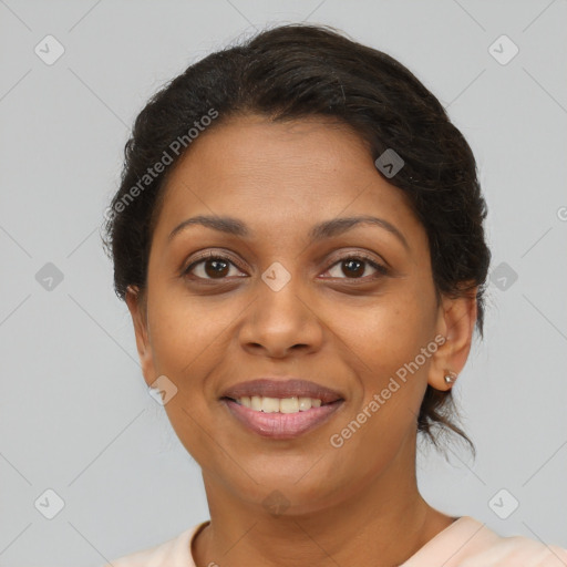 Joyful latino young-adult female with short  brown hair and brown eyes