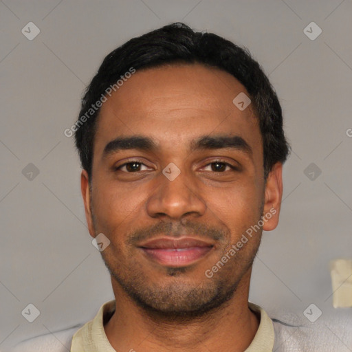 Joyful black young-adult male with short  black hair and brown eyes
