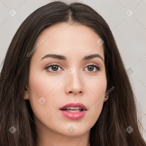 Neutral white young-adult female with long  brown hair and brown eyes