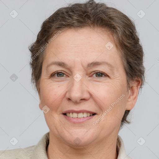 Joyful white adult female with short  brown hair and brown eyes