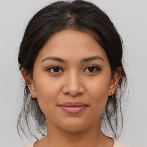 Joyful asian young-adult female with medium  brown hair and brown eyes