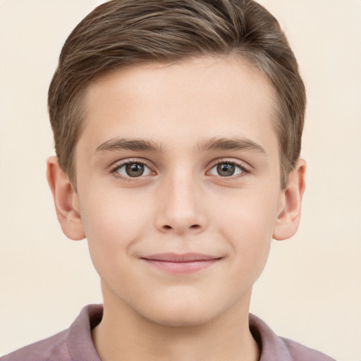 Joyful white child male with short  brown hair and brown eyes