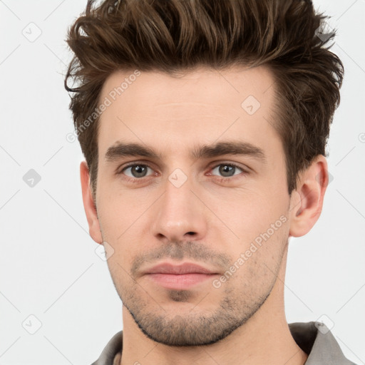 Neutral white young-adult male with short  brown hair and brown eyes