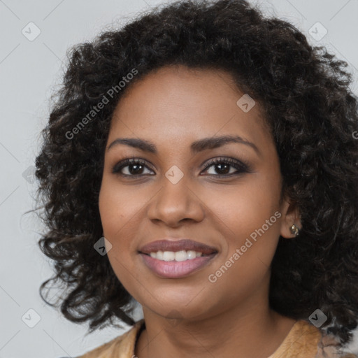 Joyful black young-adult female with long  brown hair and brown eyes