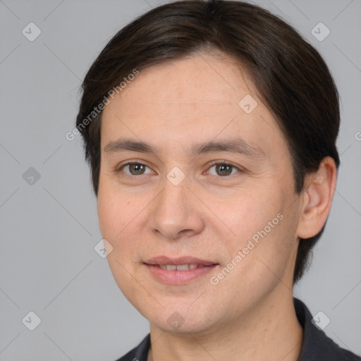 Joyful white adult female with short  brown hair and brown eyes