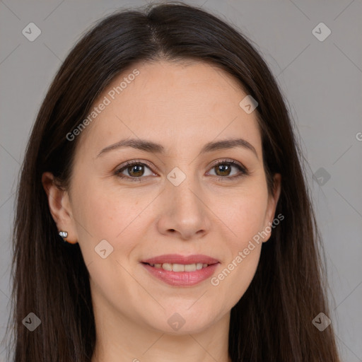 Joyful white adult female with long  brown hair and brown eyes