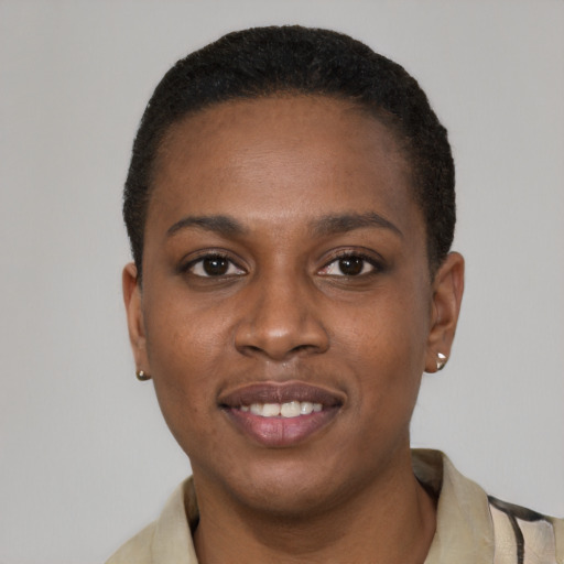 Joyful latino young-adult female with short  black hair and brown eyes