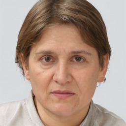 Joyful white adult female with short  brown hair and brown eyes