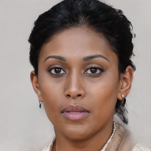 Neutral black young-adult female with short  black hair and brown eyes