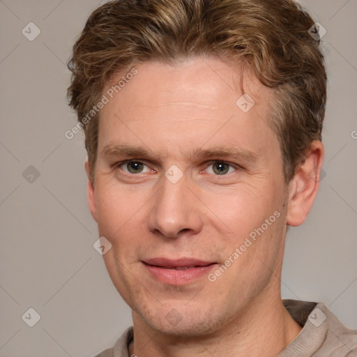 Joyful white adult male with short  brown hair and grey eyes