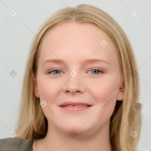 Joyful white young-adult female with long  brown hair and blue eyes