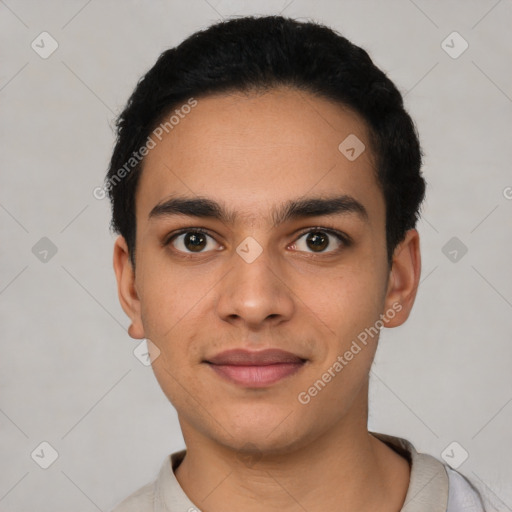 Joyful latino young-adult male with short  black hair and brown eyes