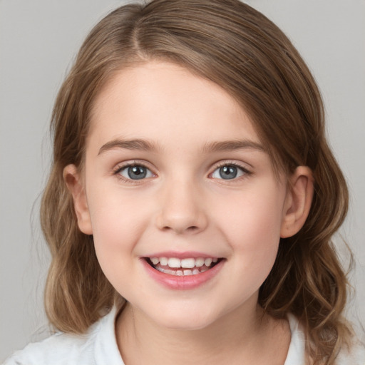 Joyful white child female with medium  brown hair and green eyes