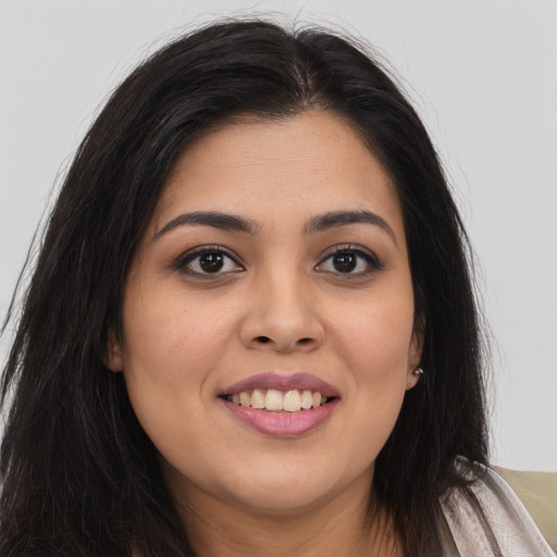 Joyful asian young-adult female with long  brown hair and brown eyes