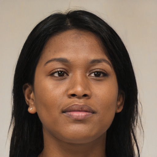 Joyful asian young-adult female with long  black hair and brown eyes