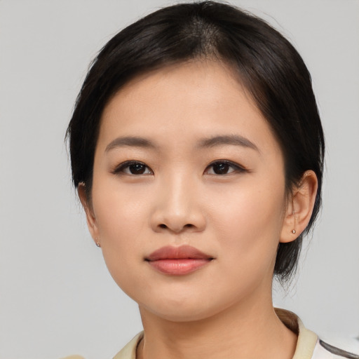 Neutral asian young-adult female with medium  black hair and brown eyes