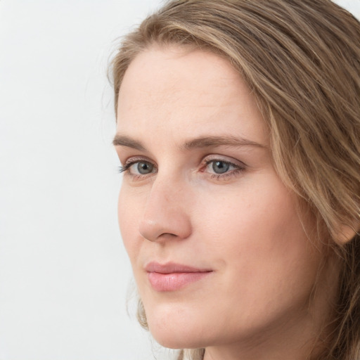 Neutral white young-adult female with long  brown hair and green eyes