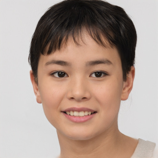 Joyful asian child female with short  brown hair and brown eyes