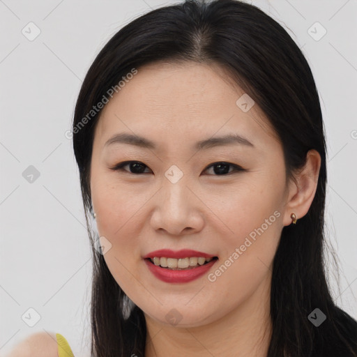 Joyful asian young-adult female with long  brown hair and brown eyes