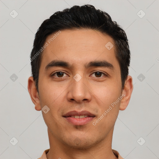 Joyful latino young-adult male with short  black hair and brown eyes