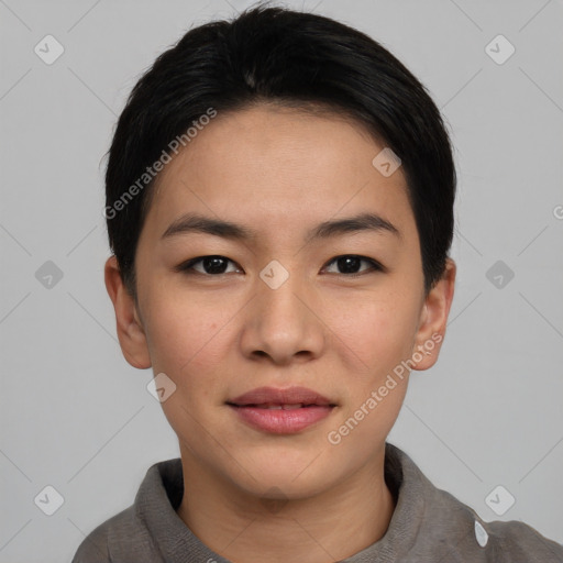 Joyful asian young-adult female with short  black hair and brown eyes