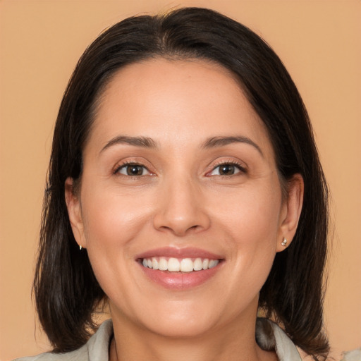 Joyful white young-adult female with medium  brown hair and brown eyes